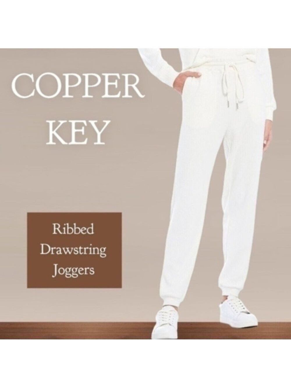 COPPER Key Ribbed Drawstring Jogger Pants with Pockets in Off White.